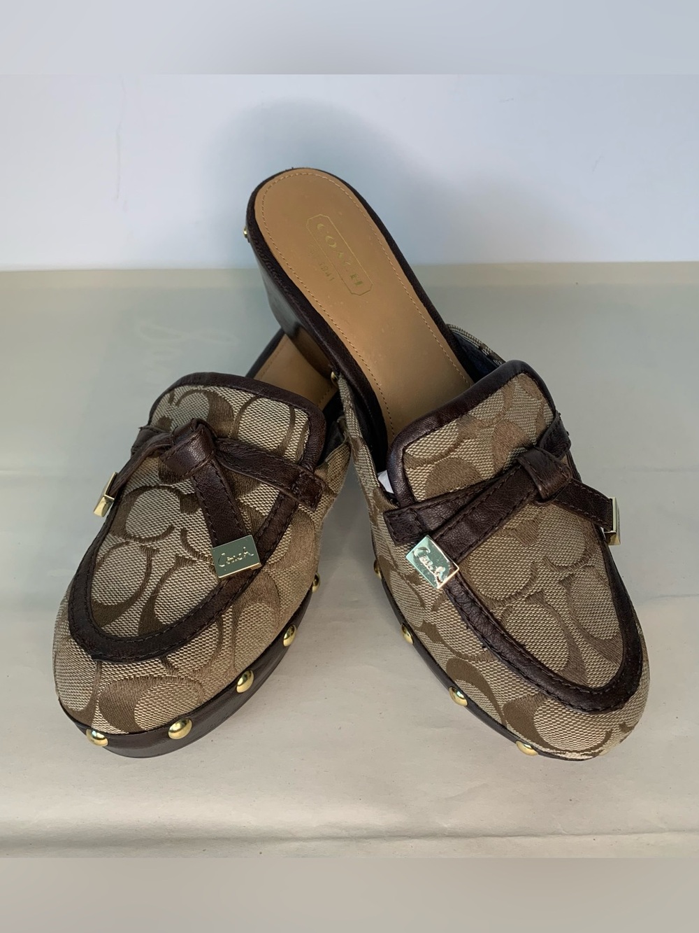 Coach Tanya studded platform clogs/mules in brown & tan. Size 7B, pre-owned.